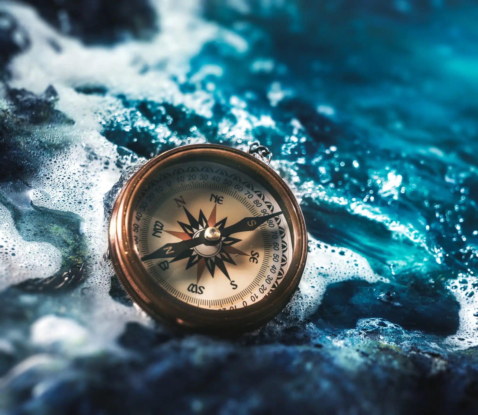 compass on rocks with a dark sky