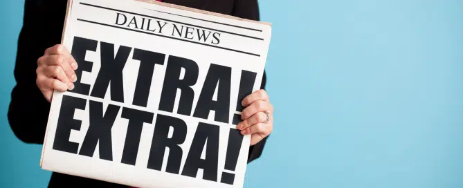 picture of business woman holding a newspaper that says "Extra! Extra!"