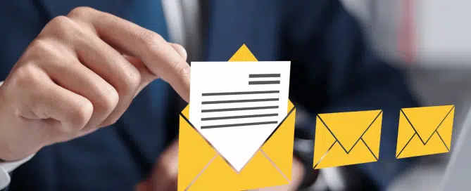 A man in a suit virtually opening one email in a line of unopened envelopes